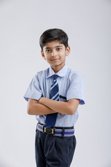 Wall Mural - Cute little indian Indian / Asian school boy wearing uniform