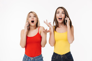 Canvas Print - Two cheerful pretty young girls isolated