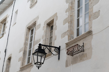 Wall Mural - Outdoor vintage medieval style lights old street lamp on wall