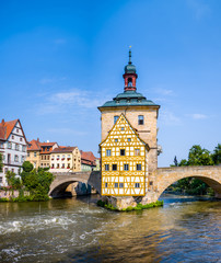 Wall Mural - View of Old Town Hall of Bamberg (Altes Rathaus) with two bridges over the Regnitz river.