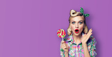 Photo Of Beautiful Very Surprised Woman With Lollipop, In Pinup Style, Over Violet Color Background