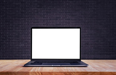 Wall Mural - Modern computer,laptop with blank screen on table and brick wall backgrounds
