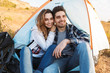 © Drobot Dean - Happy young loving couple outside in free alternative vacation camping.