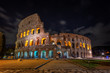 Colosseum architectural structure at night, in Rome.