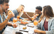 © Mirko Vitali - Friends eating and drinking spritz at fashion cocktail bar restaurant - Friendship concept with young people having fun together with drinks and food on happy hour at pub - Focus on pizza slices