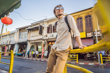 Man tourist on the Street in the Portugese style Romani in Phuket Town. Also called Chinatown or the old town