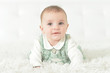 © aletia2011 - Close-up portrait of cute little baby girl on white blanket