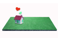 Miniature House With Heart Sign On Green Field ,love Family