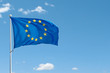© Kat Ka - European Union flag on flag pole waving in the air on blue sky background. Copy space