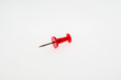 © evgenfagot - Red thumbtack close-up on white background without shadows