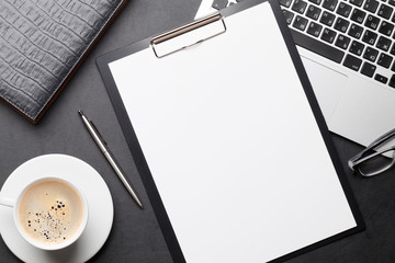 Office workplace table with blank paper page