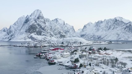 Wall Mural - Beautiful drone video of scenic Lofoten Islands archipelago winter scenery with traditional fisherman Rorbuer cabins in the historic villages Reine, Hamnoy, Sakrisoy - Norway, Scandinavia