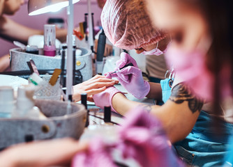 Wall Mural - Very busy manicure studio with a lot of working staff and clients.