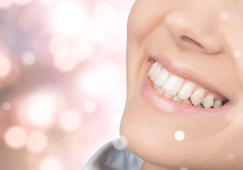 Wall Mural - Beautiful wide smile of young fresh woman with great healthy white teeth. Isolated over white background