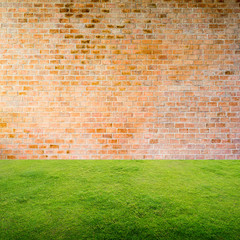 Wall Mural - old bricks wall with green grass floor background.
