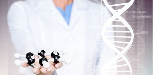 Wall Mural - Close up of Molecular structure model in hand on background