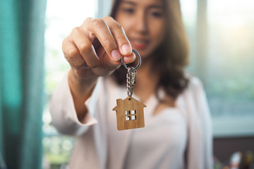 Home sales agents are giving home keys. Rent a house, buy and Sell concept