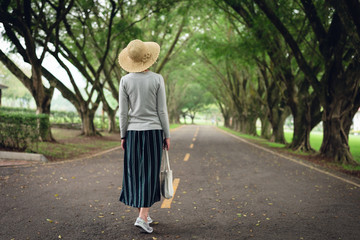 Sticker - woman take a walk on the way under the trees