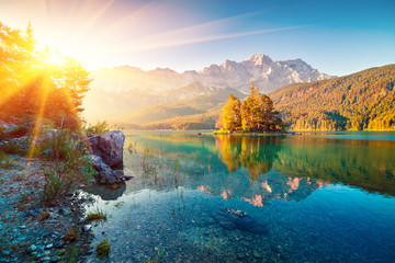 Picturesque summer view of Eibsee lake with Zugspitze mountain range. Sunny outdoor scene in German Alps, Bavaria, Garmisch-Partenkirchen village location, Germany, Europe.