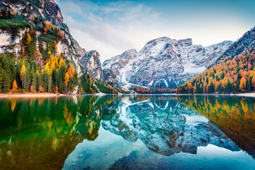 First snow on Braies Lake. Colorful autumn landscape in Italian Alps, Naturpark Fanes-Sennes-Prags, Dolomite, Italy, Europe. Beauty of nature concept background.