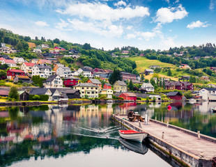 Wall Mural - Rainy summer view of Norheimsund village, located on the northern side of the Hardangerfjord. Colorful morning scene in Norway, Europe. Traveling concept background.