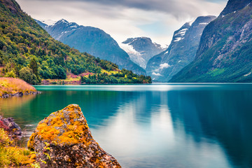Wall Mural - Dramatic summer view of Lovatnet lake, municipality of Stryn, Sogn og Fjordane county, Norway. Colorful morning scene in Norway. Beauty of nature concept background.