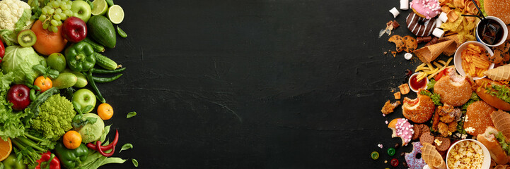 fast food dish and health food on black stone background. take away unhealthy set including burgers,