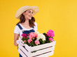 © gpointstudio - Young woman carrying wooden crate with beautiful flowers