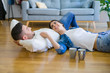 © Krakenimages.com - Young beautiful couple lying on the floor of new house, smiling in love very happy for moving to new apartment