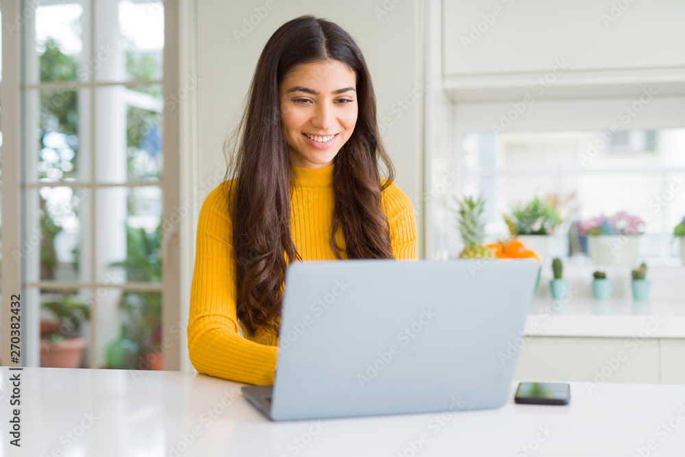 Beauitul young woman working using computer laptop concentrated and ...