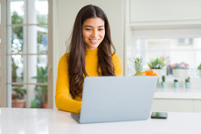 Beauitul Young Woman Working Using Computer Laptop Concentrated And Smiling