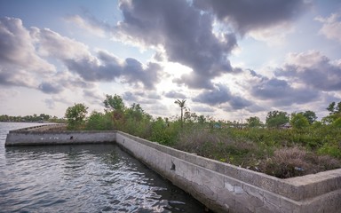 Wall Mural - Concrete wall constructed in between Ashtamudi lake and Munroe Island for minimizing flooding