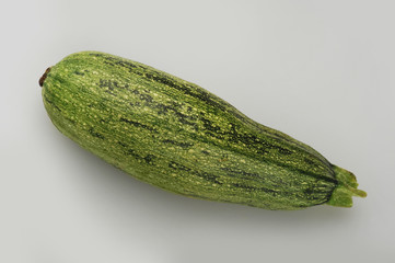 Fresh zucchini isolated on a gray background