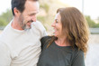© Krakenimages.com - Romantic couple smiling and cuddling looking at each other on a sunny day