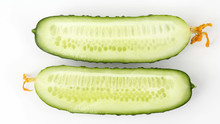 Cut Lengthwise The Cucumber On The White Background