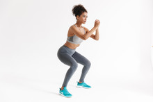 Amazing Stronger Sports Fitness African Woman Make Exercises Isolated Over White Wall Background.