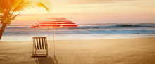 Tropical Beach In Sunset With Beach Chair And Umbrella