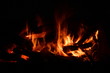 © Александр Северенюк - Night fire. The logs of the trees quietly smoldering some burn with a small flame creating a relaxing mood.