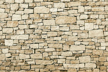 Wall Mural - Old beige stone wall background texture