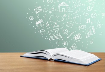 Wall Mural - open book on old wooden table.