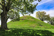 Moundsville, West virginia, just outside of Wheeling, is home to the Grave Creek Mound.  This historic landmark burial mound was built by the Arena people.
