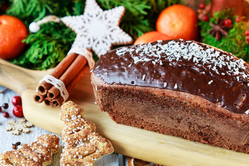 Canvas Print - Christmas gingerbread cake among traditional decorations.