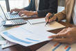 © PIC SNIPE - Business team brainstorming and discussing with financial data and report graph. Teamwork meeting working concept.