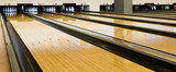 Bowling wooden floor with lane, Generic Bowling Alley lanes with bowling ball going towards the pins.