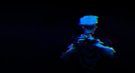 Man with virtual reality headset is playing game. Image with glitch effect.