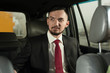 © pavel_shishkin - Young handsome businessman sitting in the car