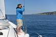 © Visionsi - Man sailing with sails out on a sunny day