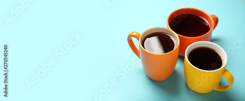 Black tea (coffee) in bright cups, office break, team building.
