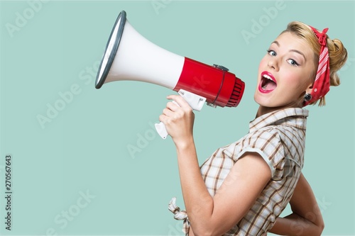 Fotografía Portrait of woman holding megaphone, dressed in pin-up style