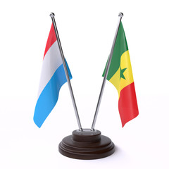 Luxembourg and Senegal, two table flags isolated on white background. 3d image